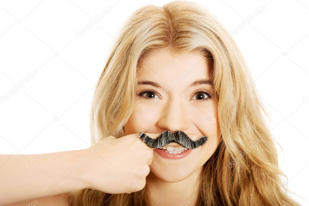 Blonde student with mustache looking at camera