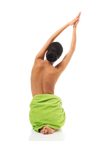 Back view woman sitting stretching arms above her — Stock Photo, Image