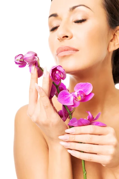 Naked woman with purple orchid and closed eyes — Stock Photo, Image