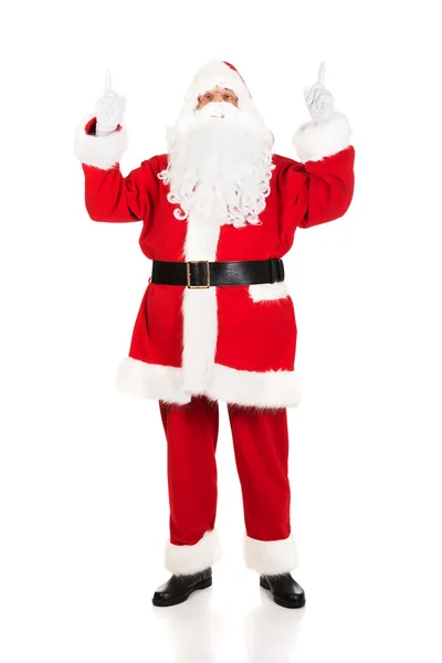 Weihnachtsmann in voller Länge zeigt die Hände nach oben — Stockfoto