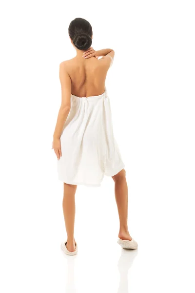 Woman in towel touching her neck — Stock Photo, Image