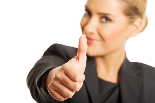 Businesswoman with thumb up gesture Stock Image