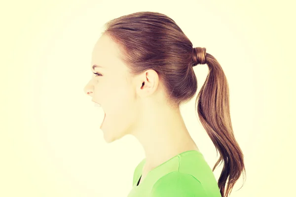 Young casual woman screaming with anger — Stock Photo, Image