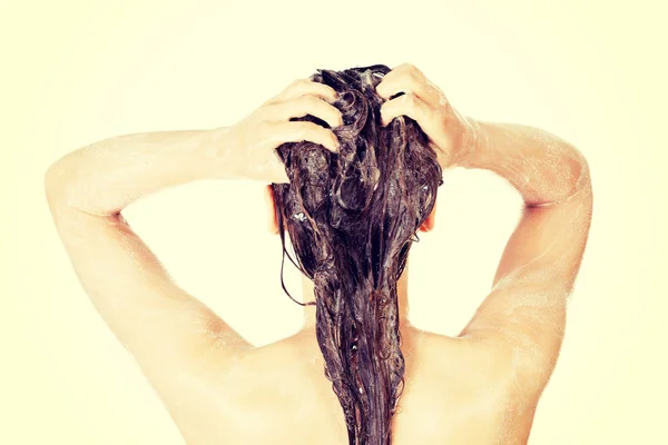 Young fit woman in shower — Stock Photo, Image