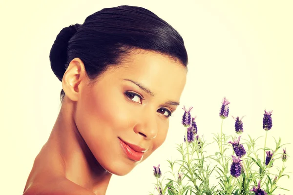 Beautiful girl smell lavender flowers — Stock Photo, Image