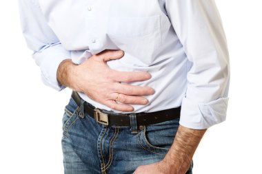 Close up on mature man suffering from stomachache clipart