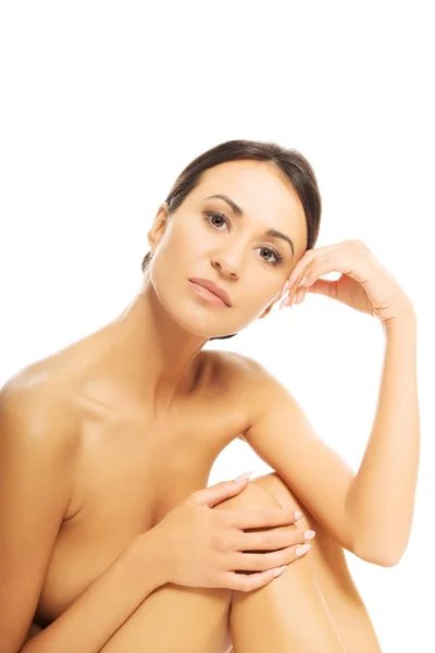 Portrait of nude woman sitting looking at camera — Stock Photo, Image