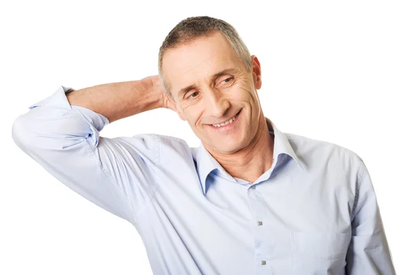 Portrait of a good looking man touching his head — Stock Photo, Image