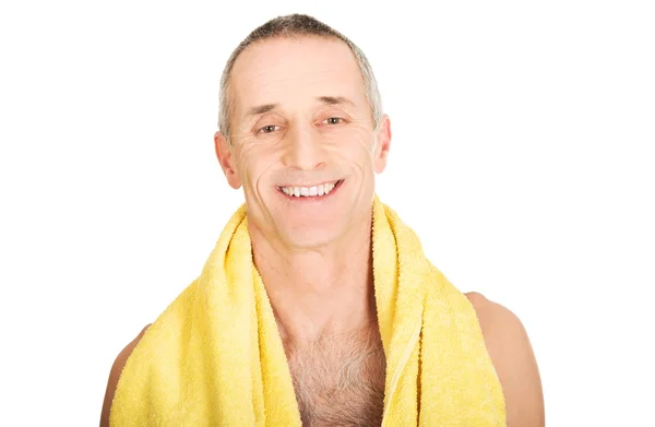 Portrait of mature man holding towel around neck — Stock Photo, Image