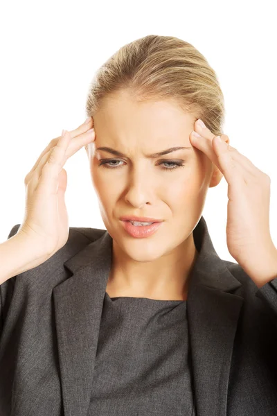 Businesswoman having huge headache — Stock Photo, Image