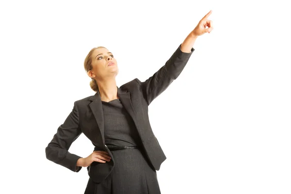Mujer de negocios apuntando alto en el espacio de copia —  Fotos de Stock
