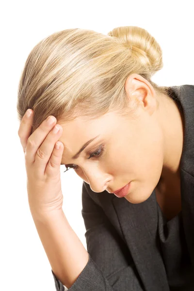 Portrait of depressed businesswoman sitting on armchair — Stock Photo, Image