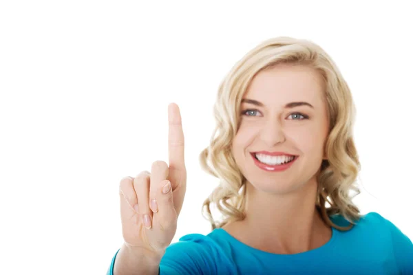 Portrait of woman pushing imaginary button — Stock Photo, Image