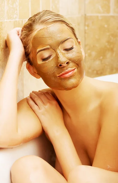 Woman with chocolate mask based on a bath by elbow — Stock Photo, Image