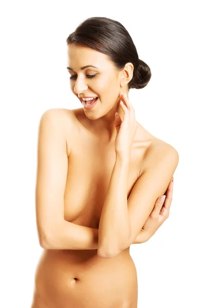 Čelní pohled krásná nahá žena drží ruku na bradě, při pohledu dolů — Stock fotografie