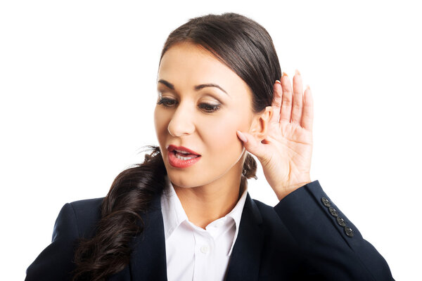 Portrait of young beautiful businesswoman overhears