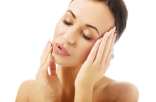 Portrait of nude woman touching her face — Stock Photo, Image