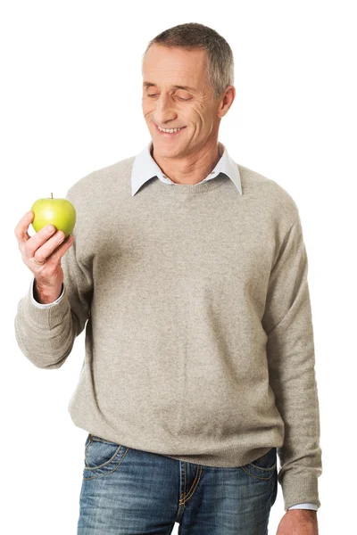 Feliz hombre maduro con una manzana —  Fotos de Stock