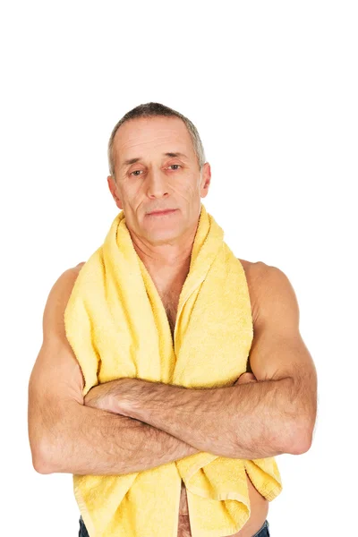 Mature man holding towel around neck — Stock Photo, Image