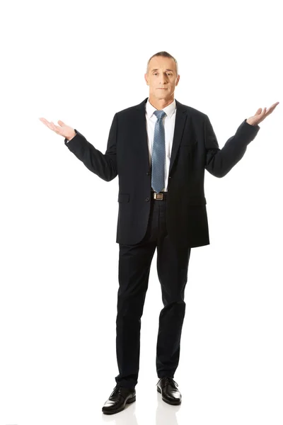 Full length businessman in undecided gesture — Stock Photo, Image