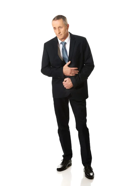 Full length businessman suffering from stomachache — Stock Photo, Image