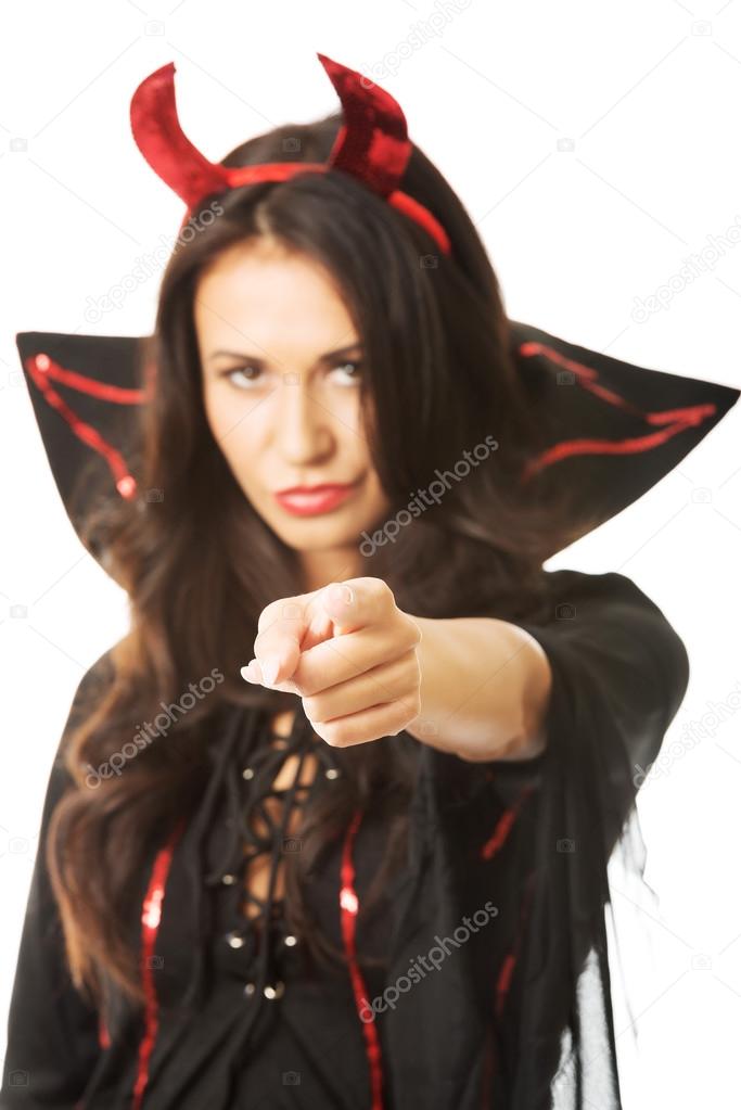Portrait woman devil clothes pointing on you
