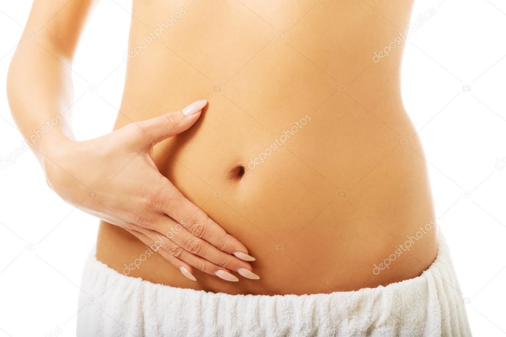 Woman touching her slim belly