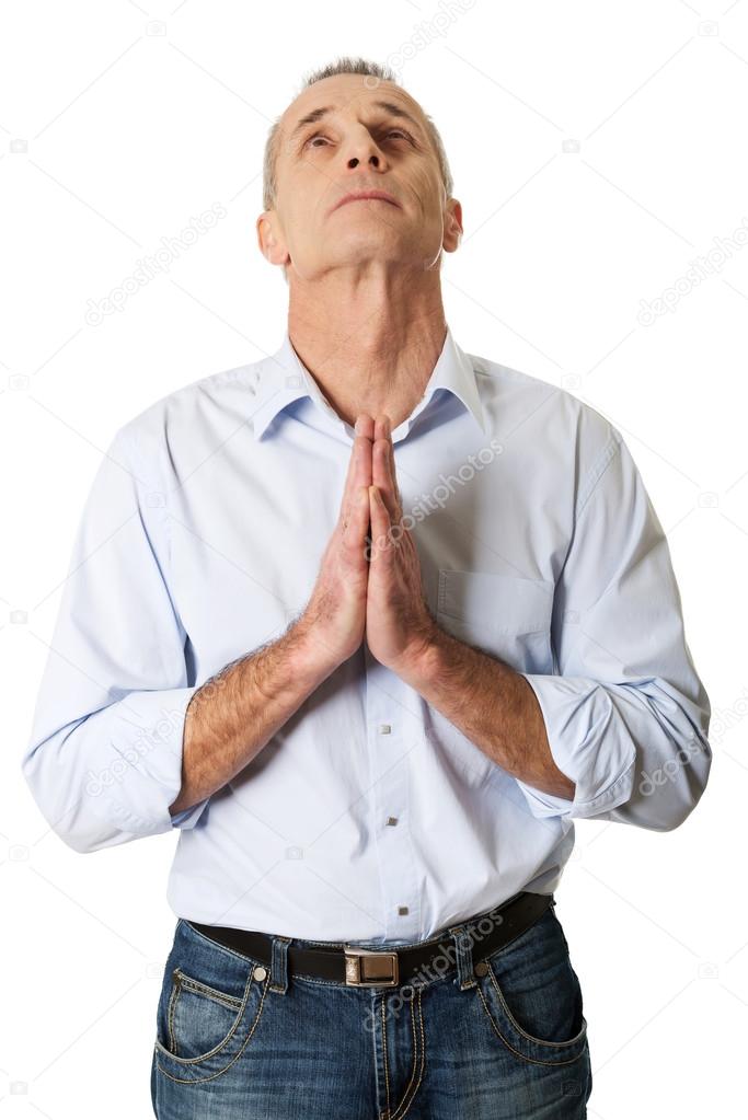 Portrait of a man praying to God
