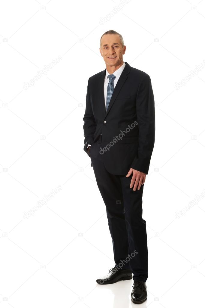 Full length businessman with hand in pocket