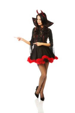 Woman wearing devil clothes pointing left clipart