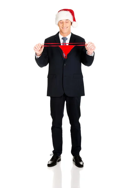 Santa businessman holding female thongs — Stock Photo, Image