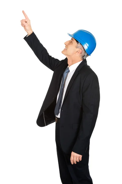 Side view of businessman engineer pointing up — Stock Photo, Image