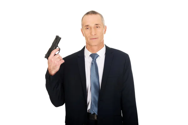 Portrait of serious mafia agent with handgun — Stock Photo, Image