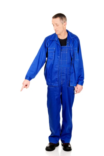 Full length repairman pointing down — Stock Photo, Image