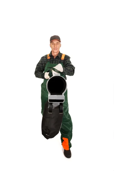 Trabalhador em uniforme com um ventilador de folha — Fotografia de Stock
