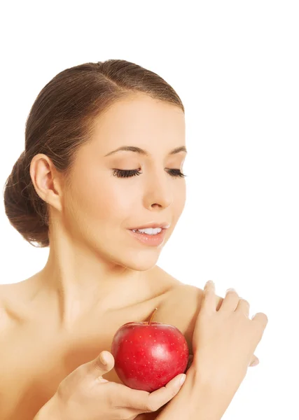 Naga kobieta trzyma jabłko — Zdjęcie stockowe