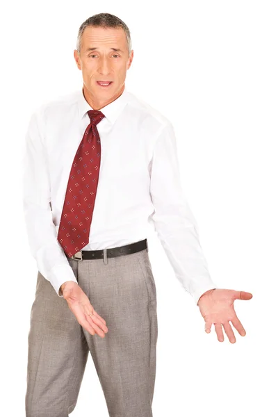 Businessman showing copyspace on the floor — Stock Photo, Image