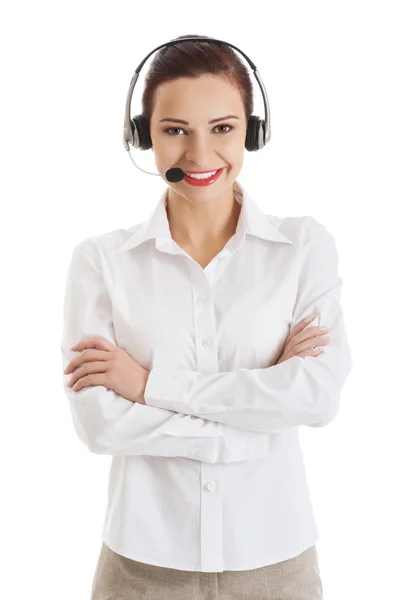 Lächelnde Callcenter-Frau mit verschränkten Armen — Stockfoto