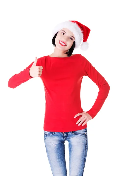 Frau in Weihnachtsmannkleidung gestikuliert mit den Daumen nach oben — Stockfoto