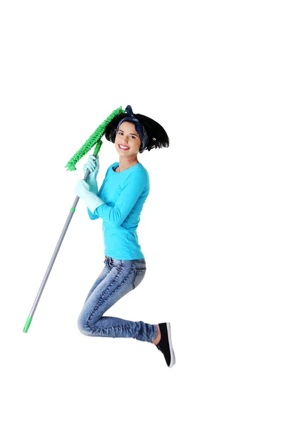 Portrait of jumping woman with a mop — Stock Photo, Image