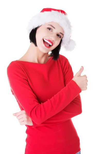 Woman in santa clothes gesturing thumbs up Royalty Free Stock Images