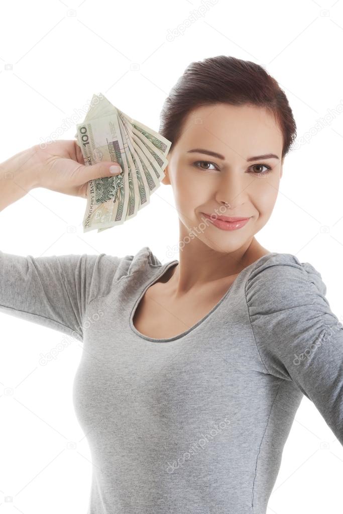 Woman holding a clip of polish money