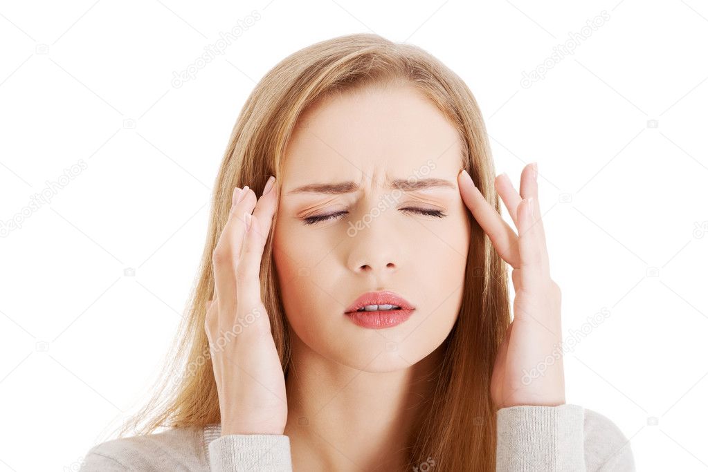 Portrait of young woman with huge headache