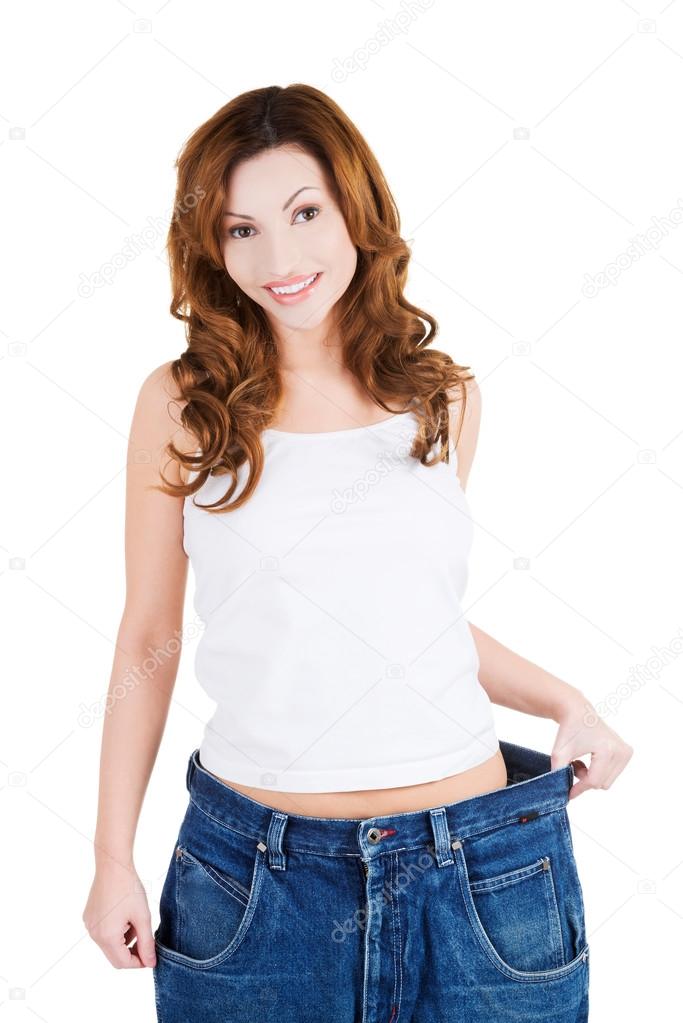 Successful woman in too big jeans