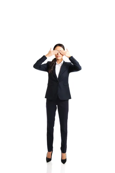 Businesswoman covering eyes with hands — Stock Photo, Image