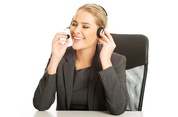 Call center woman sitting at the desk — Stock Photo, Image