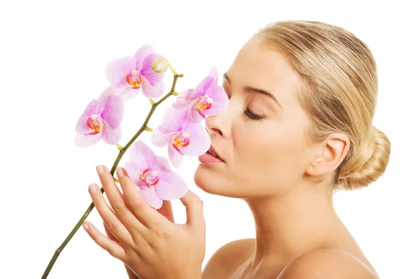 Portrait of nude woman with purple orchid — Stock Photo, Image