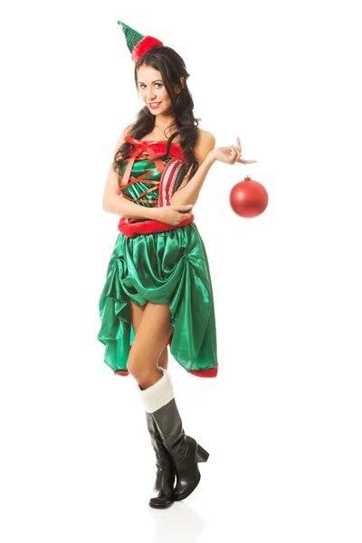 Woman hanging christmas bubble on her finger — Stock Photo, Image