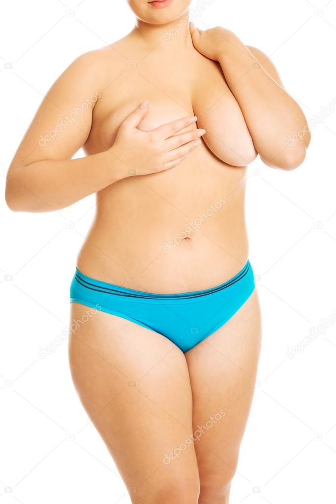 Overweight woman covering her breast