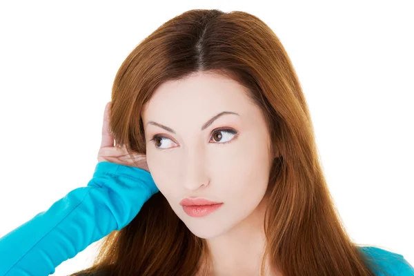 Interested woman overhears a conversation — Stock Photo, Image